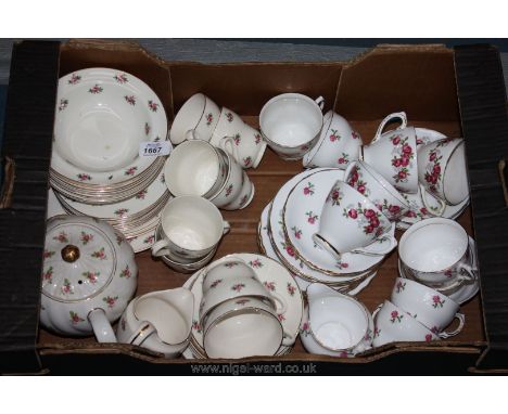 A quantity of Bristol, Colclough and Royal Sutherland china including cups, saucers, plates and teapot in rose pattern