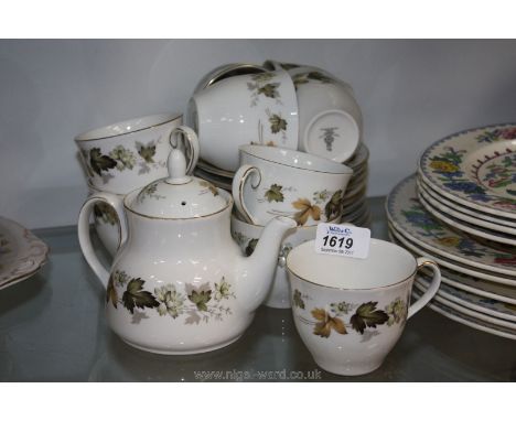 A Royal Doulton "Larchmont" Teaset including nine cups and saucers (some chips to cups) and teapot 