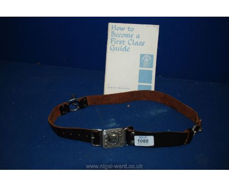 A vintage Girl Guide Belt and Booklet on 'How to become a lst class Guide'