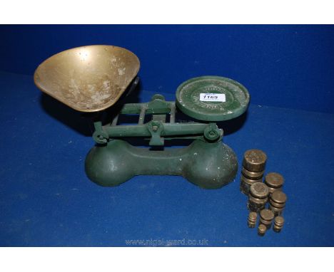 A set of green ''Boots of Nottingham'' weighing Scales with five weights