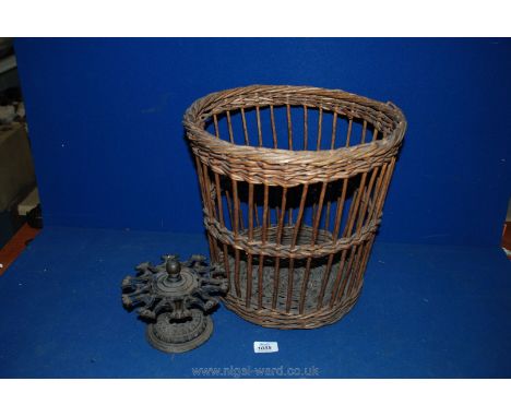 A vintage Cast Iron Rubber Stamp Stand and vintage wicker paper basket