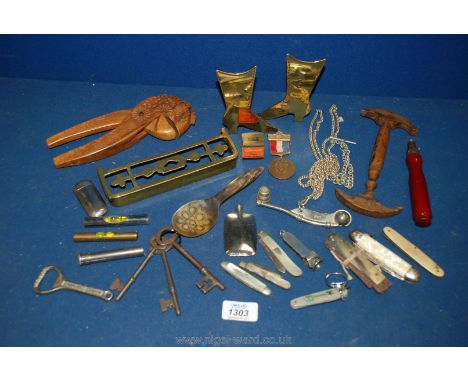 A box of miscellanea including pair of brass ladies boots, mini brass fender, wooden nutcracker, hat stretcher, bosun's whist