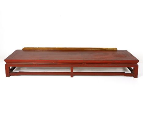 A CHINESE RED LACQUER LOW BENCH/ SEAT
LIkely cut down from table height, with humpback stretchers and later added plywood sho