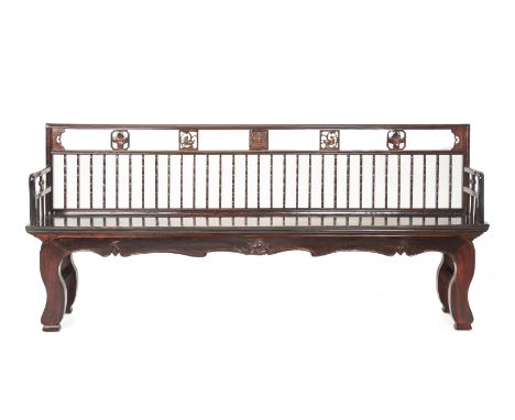 A LONG CHINESE COMB-BACK BENCH
The top rail set with alternating carved animals and flowers, above the rail back, the shaped 