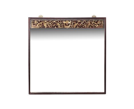 A SQUARE WALL MIRROR WITH CARVED GILTWOOD PANEL
The top with a decorative carved wood panel featuring a central bat and birds