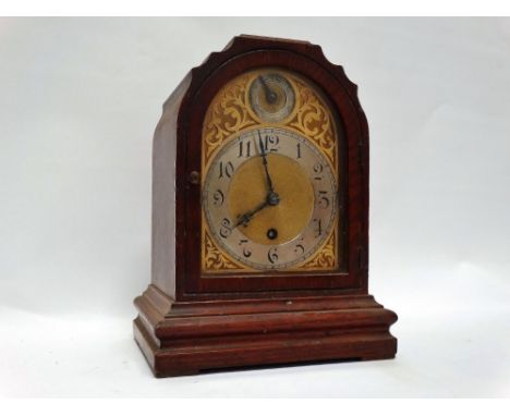Circa 1900 mantle clock - A stained oak cased timepiece with slow/fast dial to top and silvered chapter ring on engraved gilt