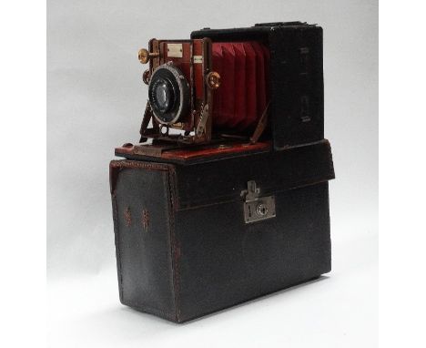 A quarter-plate Sanderson hand-and-stand camera, 'Regular Model' in black leather-covered mahogany casing with Zeiss Tessar f