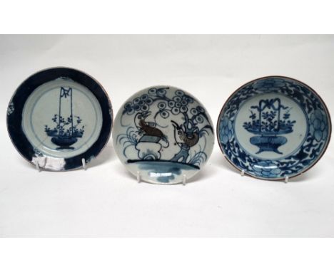 18th/19th century Chinese saucers - A blue and white plate decorated with an urn of flowers, hand painted mark to base, diame