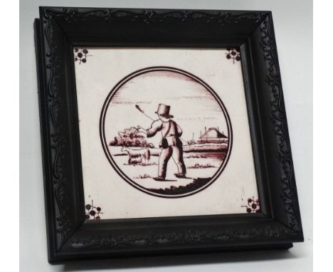Delft - A Dutch manganese framed tile of a shepherd boy and sheep, overall size 17.5 x 17.5cm.