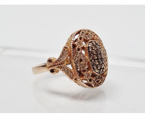 14ct gold and diamond ring - A pave set ring with a pierced and shaped top and shaped shoulders, size O.