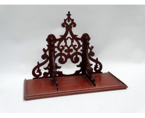 Mahogany wall bracket - An early 20th century fretwork decorated wall bracket/clock shelf, height 24cm, width 33.5cm. 