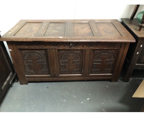 17th century and later coffer - With carved three panel front and lunettes of dowel construction, height 66cm, width 132.5cm,
