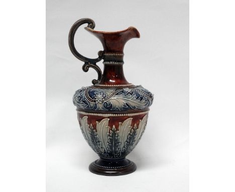 Doulton Lambeth Art Union Of London - A baluster shaped ewer with double veloupe handle with bas and tubeline relief, No.2781