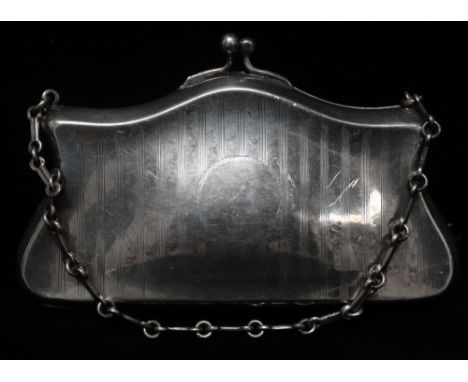 A silver plated dress purse on chain with engine turned striped decoration to one side, width 13cm, height 7.8cm. 