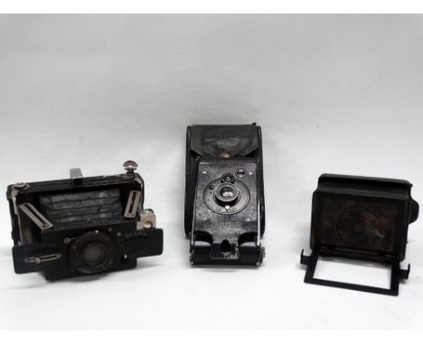 An unusual 6cm x 4 cm leather-covered folding strut camera of metal construction with struts inside leather bellows, folding 