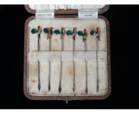 A cased set of silver cocktail sticks with enamel terminals modelled as cockerels, Birmingham 1935.