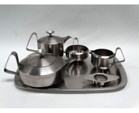 Robert Welch - A mid century stainless steel tea set, comprising a teapot, tea strainer, hot water jug, milk jug, sugar bowl 