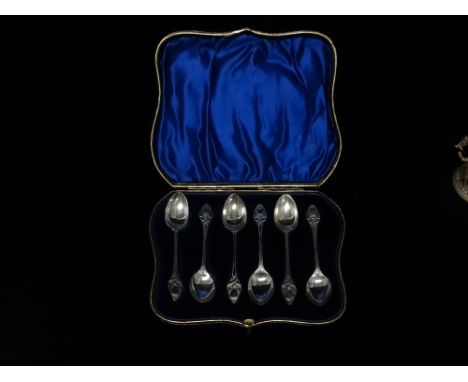 Art Nouveau - A set of six silver teaspoons with tendril decoration to the terminals and shaft, Birmingham 1906, maker's mark
