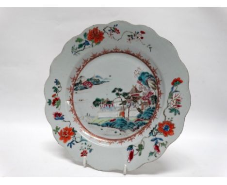 18th/19th century Chinese plate - A polychrome enamel decorated plate depicting a pagoda and pavilion in a river landscape wi