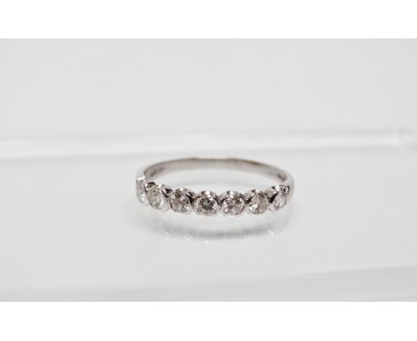 A 18ct white gold and diamond ring - A white gold ring set seven diamonds totalling 0.56ct approximately, size T, weight 2.6g