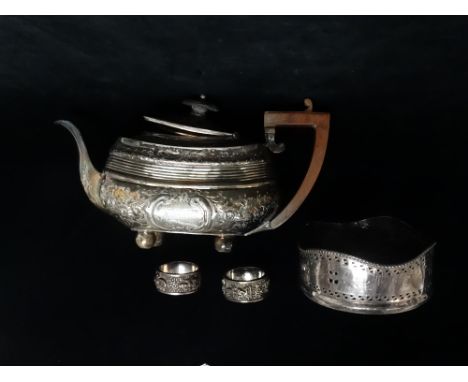 A silver plated teapot with repousse decoration, the cartouches marked 'MEEATT MEER EAST INDIES FEBRUARY 22ND 1865' and 'Pres