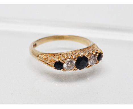 An 18ct gold diamond and sapphire ring - An 18ct gold ring set three sapphires and two diamonds, size N/O.