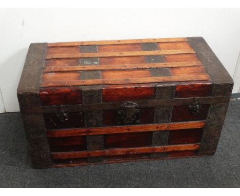 A 19th century steel bound and oak banded trunk/chest - The paper lined pine chest with twin carrying handles, height 41cm, l