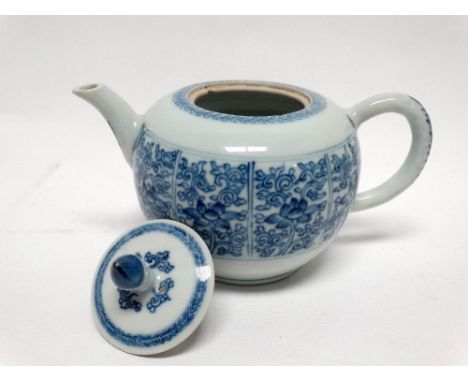 Circa 1900 Chinese lidded teapot - A blue and white peony and scroll decorated teapot, height 11.5.