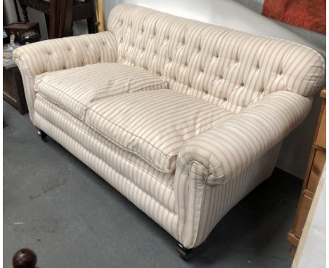 Victorian button back two seater sofa - A recovered feather upholstered scroll arm sofa on square shaped feet and castors, he