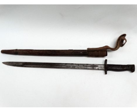 MILITARIA - A circa 1900 Wilkinson of Pall Mall bayonet with leather covered scabbard and webbing hanger, length 56cm. 