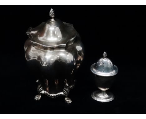 A silver tea caddy of inverted baluster melon shape, with hinged lid and standing on four lion's paw feet, Chester 1901, make