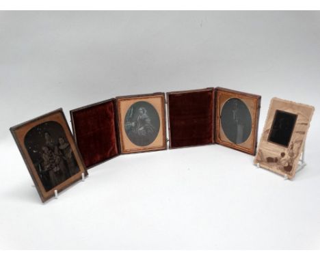 Three quarter-plate ambrotype portraits comprising: two of an elderly lady, each in morocco case, and one of a mother and chi