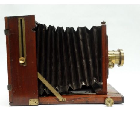 A large Rayment's Patent 10 x 12 mahogany filed camera by Perken, Son &amp; Rayment, London with Ross portrait lens, in verti