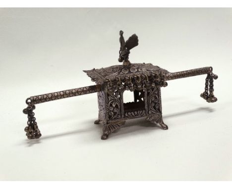 A Chinese circa 1900 white metal model of a sedan chair, the finial modelled as a cockerel, stamped 'SILVER' to base, height 