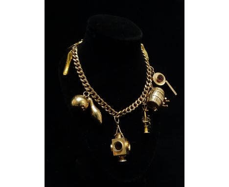 9ct gold charm bracelet - A 9ct gold curb link bracelet with ten charms, comprising a dolphin and ball, a whistle, a beer bar