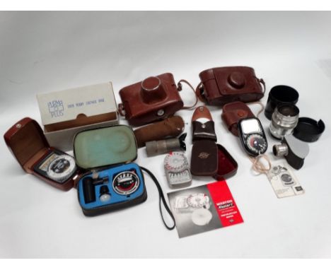 A Russian Fed 3, 35mm camera with standard and telephoto lenses and every-ready case; a Purma Plus 35mm camera and e.r.c., in