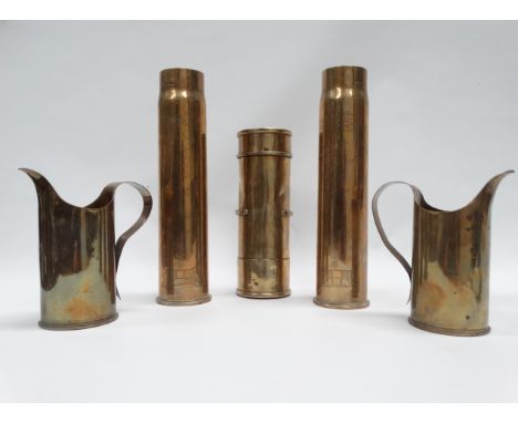 MILITARIA - Trench Art, a pair of Remington brass 75 shell made jugs, height 17.3cm, a 1917 and 1918 brass field shells with 