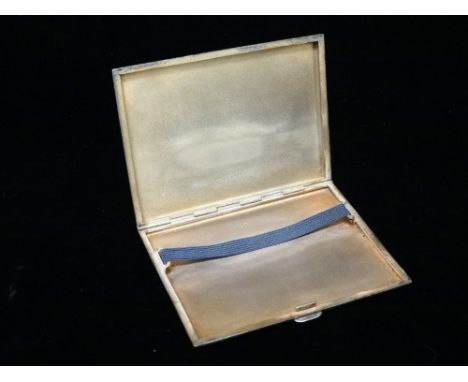 A silver engine turned cigarette case, monogram to lid, Birmingham , maker's mark for Kenart Ltd, weight 164g. 
