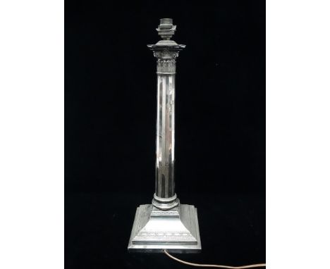 Early 20th century silver plated table lamp - A Doric lamp with sixteen faceted sides on a tapering stepped base with swag de