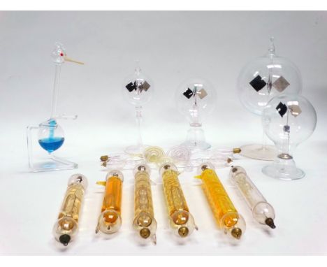 Scientific instruments - Thirteen glass instruments, to include four pedestal vacuum spinners and nine liquid filled heat act