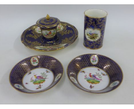 A collection of English porcelain items to include an inkwell, small vase and two saucers, all with blue ground and bird patt