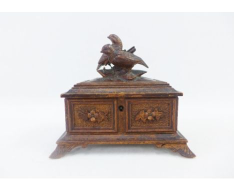 Black Forest style carved wooden box, the hinged lid with birds, on bracket feet, 20 x 18cm 