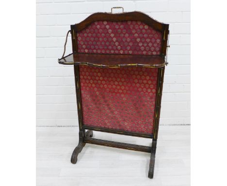 19th century walnut fire screen,  with serpentine top rail and brass carry handle to top, fabric panel and drop down shelf, w