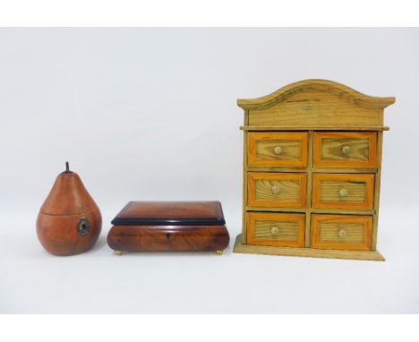 Wooden items to include a Pear shaped caddy box, miniature pine dresser and a jewellery box with hinged lid, (3) 