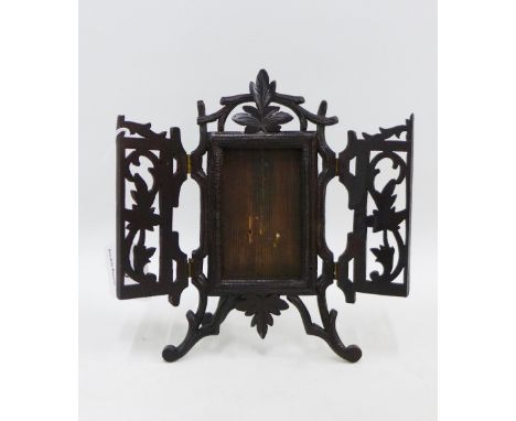 Black Forest style carved wooden frame with an easel back, 22cm high 
