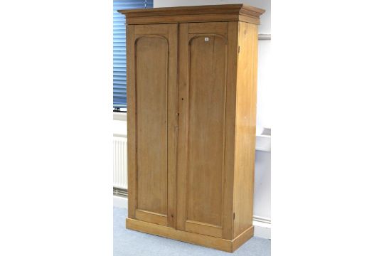 A Pine Wardrobe With Hanging Compartment Above A Long Drawer