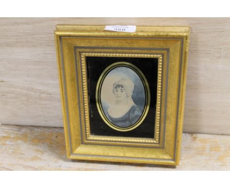 A MINIATURE PORTRAIT OF A LADY IN A WHITE BONNET, IN A MODERN GILT FRAME