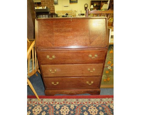 A VINTAGE OAK BUREAU WITH BRASS CARRY HANDLES