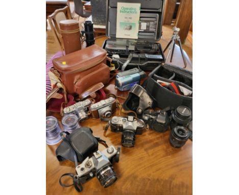 Group of cameras and video recorder including a Praktica LTL film camera and a Pentalon 2.8/28mm lens, A Kodak Retina Reflex 