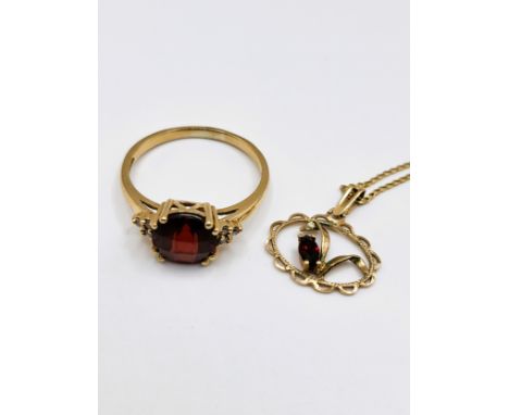 A 9ct yellow gold, diamond, and garnet ring, set with a round chequerboard-cut garnet, size P 1/2, together a 9ct yellow gold